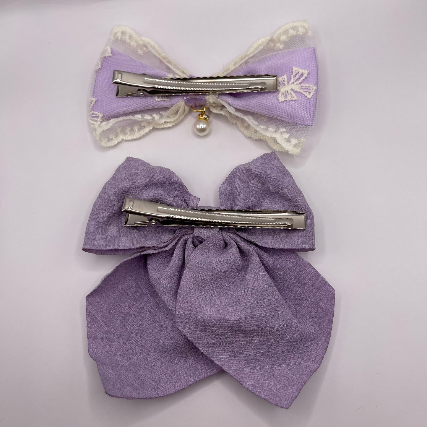 Two bows with pearl (purple)