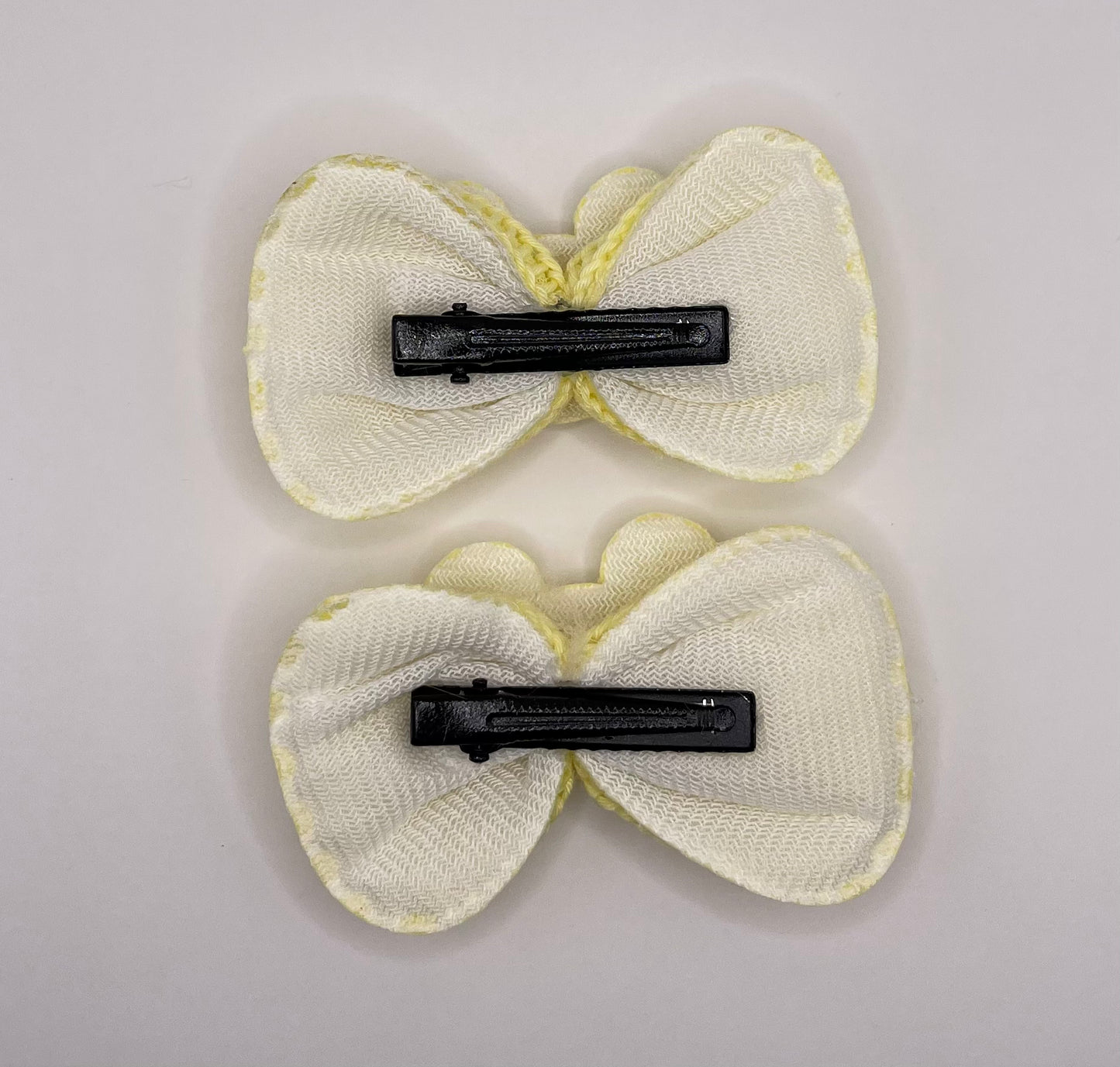 Two baby Minnie bows (yellow)