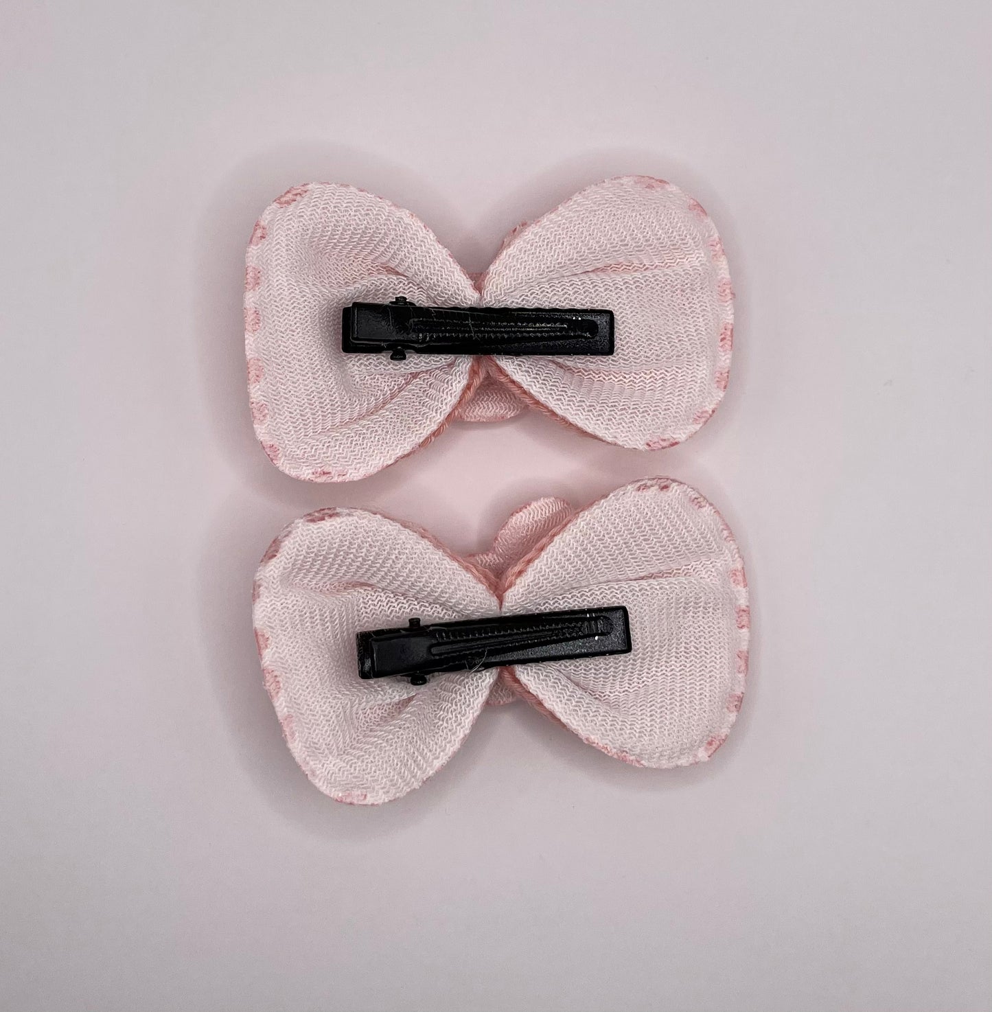 Two baby Minnie bows (pink)