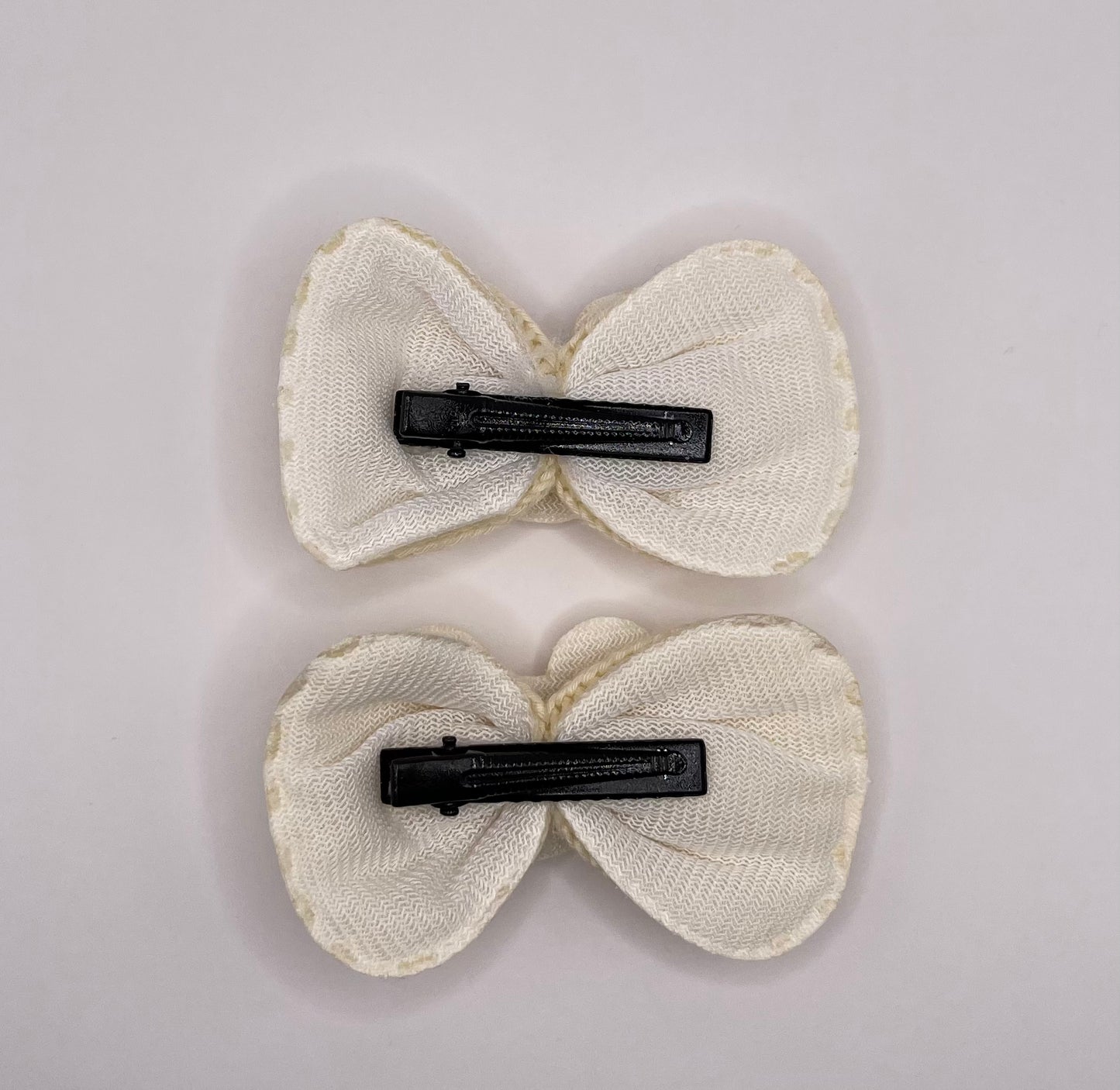 Two baby Minnie bows (beige)