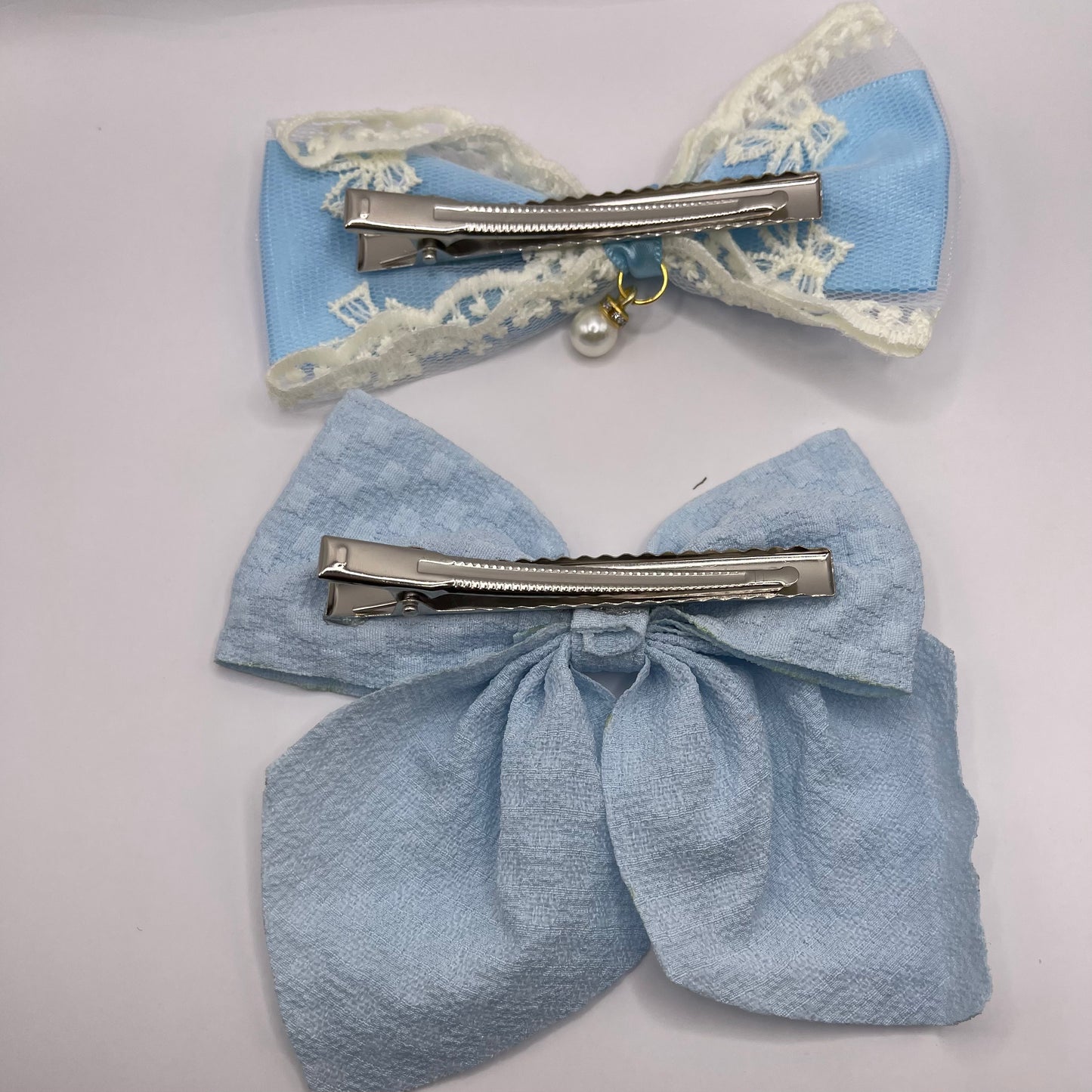 Two bows with pearl (blue)